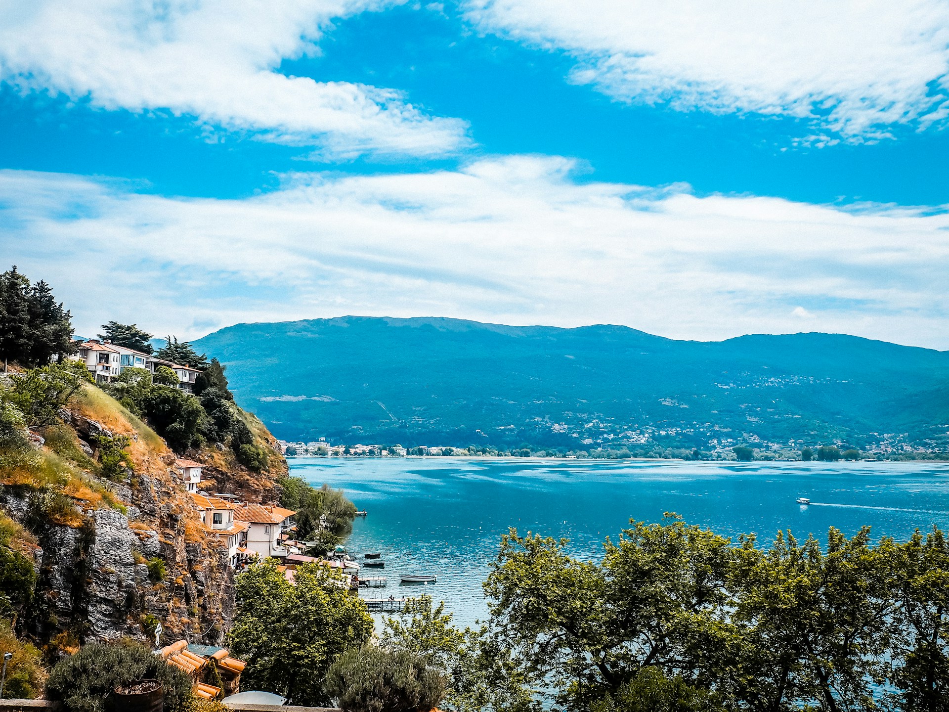 Ancient Lake Ohrid, one of Europe’s oldest lakes, surrounded by mountains and crystal-clear waters.